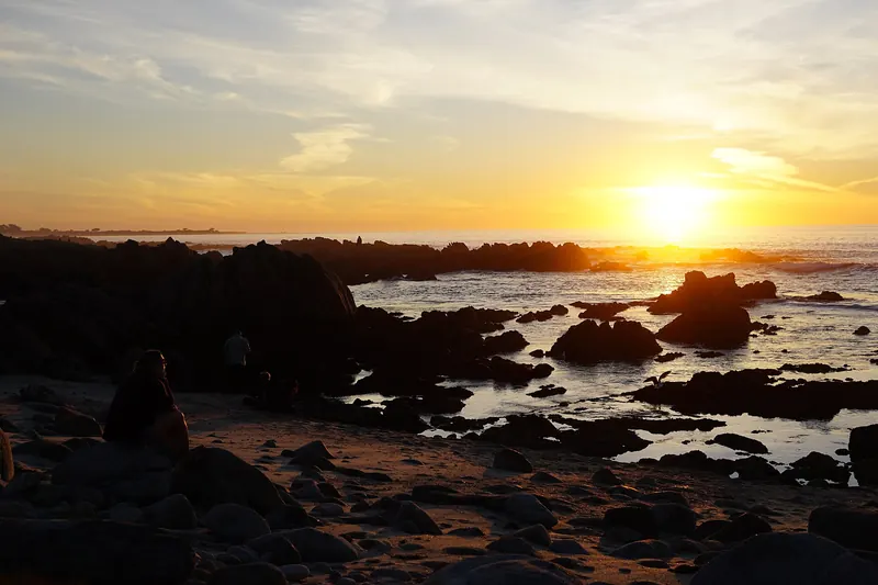 Sunset over the rocky tide pools at Asilomar State Beach