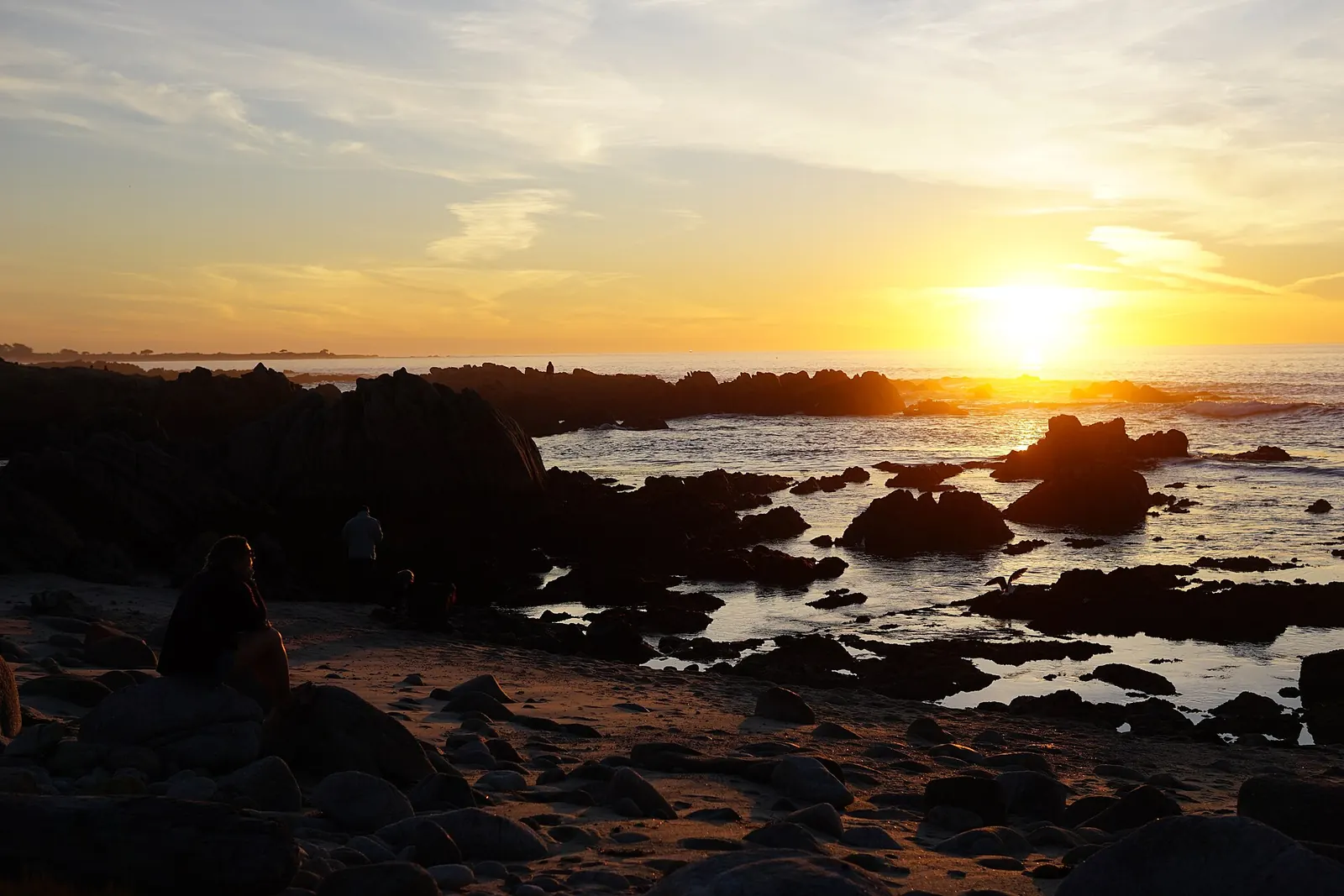 Sunset over the rocky tide pools at Asilomar State Beach