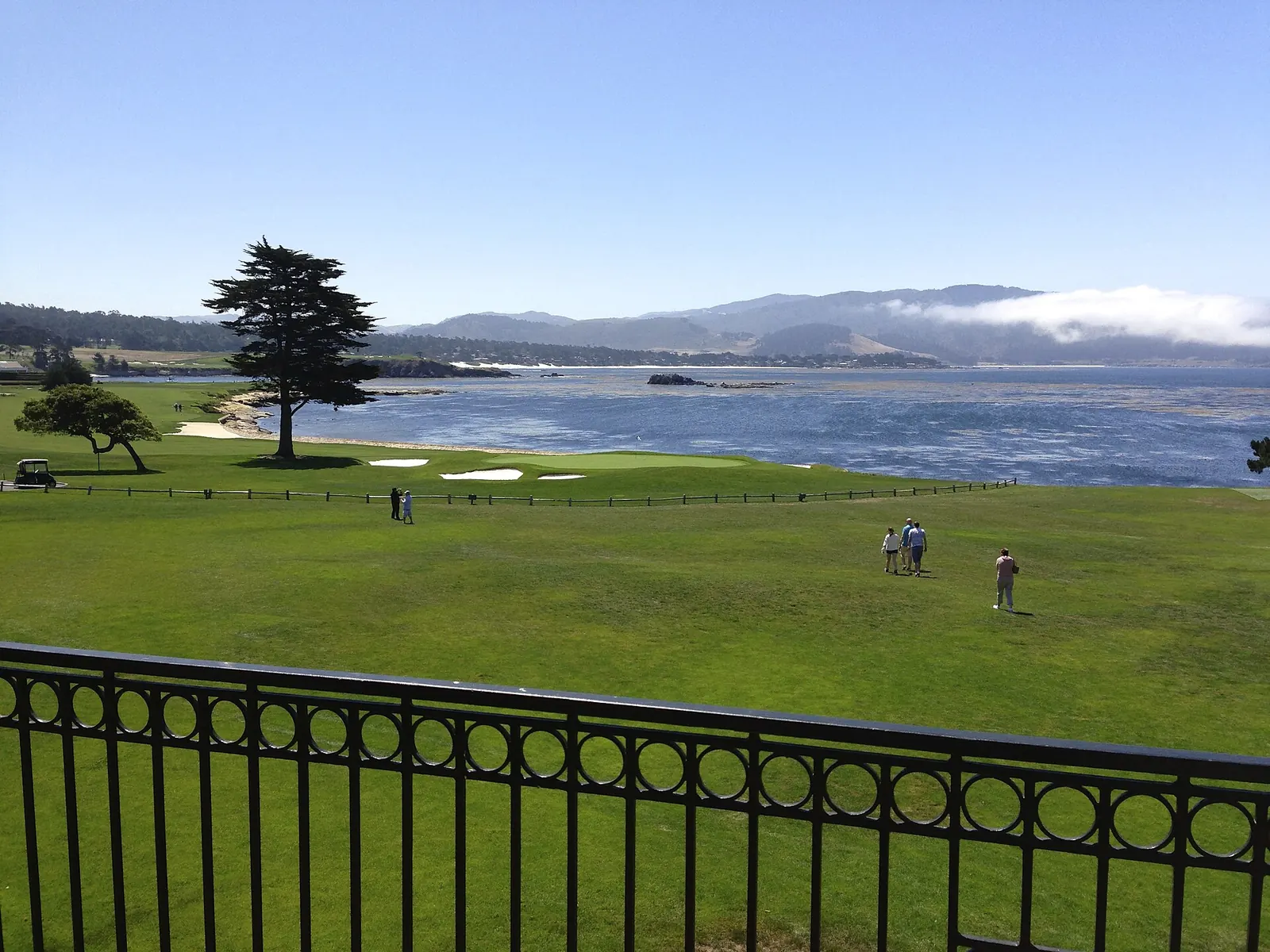 The 18th green at Pebble Beach Golf Links beside Carmel Bay