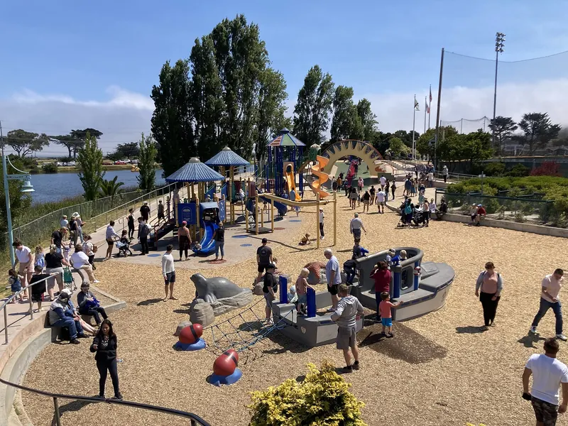 Families playing at Dennis the Menace Park in Monterey