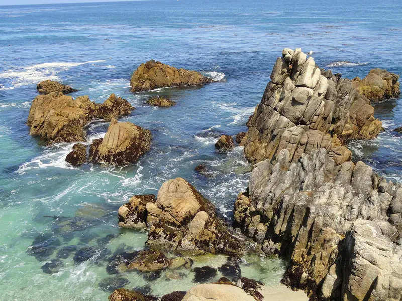 Granite rocks and clear water at Lovers Point Park in Pacific Grove